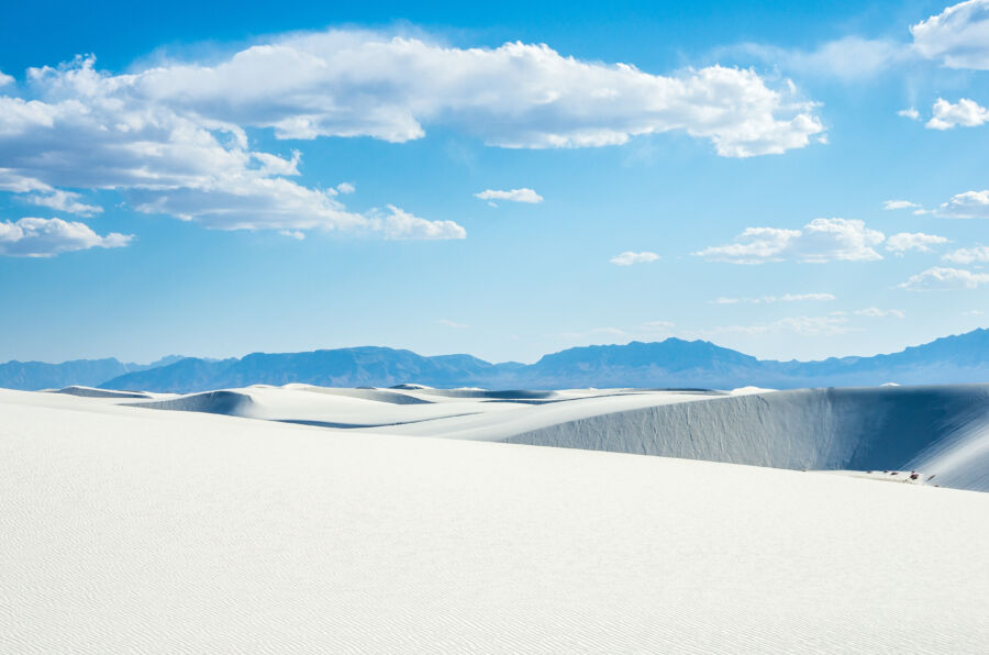 White sand dunes and blue cloudy sky in New Mexico desert