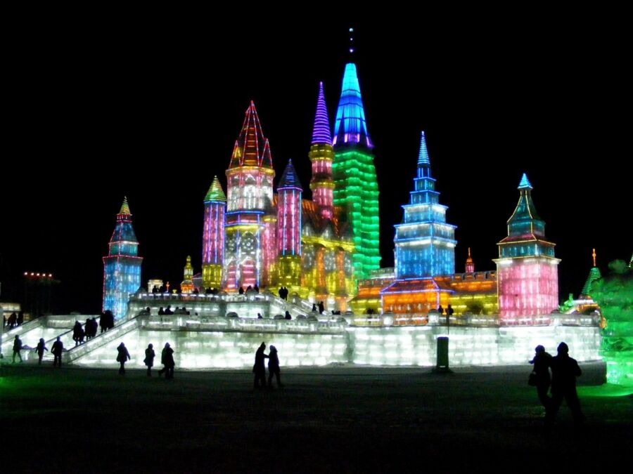 Ice festival castle with colorful lights, winter wonderland, Harbin International Snow and Ice Festival.