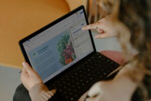 Busy woman working remotely on laptop