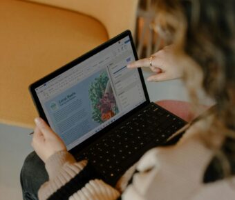 Busy woman working remotely on laptop