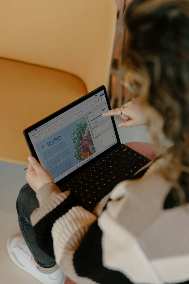 Busy woman working remotely on laptop