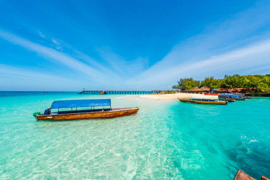 colorful seascape with boats near Zanzibar shore